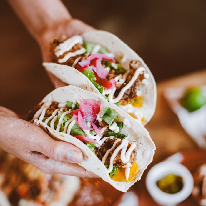 Close-up of flavorful beef tacos with fresh toppings, perfect for a tasty meal.