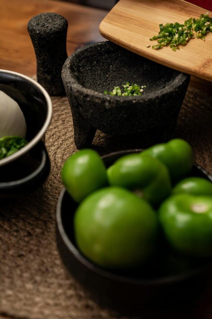 Close-up of fresh Mexican ingredients with molcajete, perfect for authentic cuisine photography.